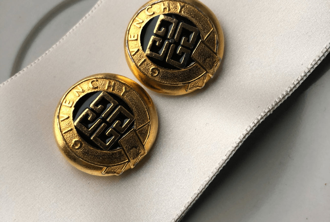 Vintage Givenchy buttons that will be repurposed into pendants charms.